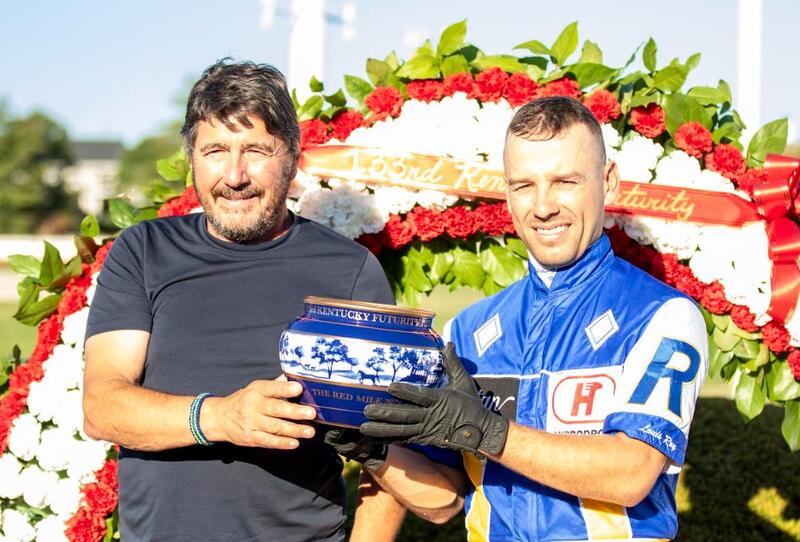 Luc-Blais-left-and-Louis-Roy-right-holding-the-Kentucky-Futurity-trophy